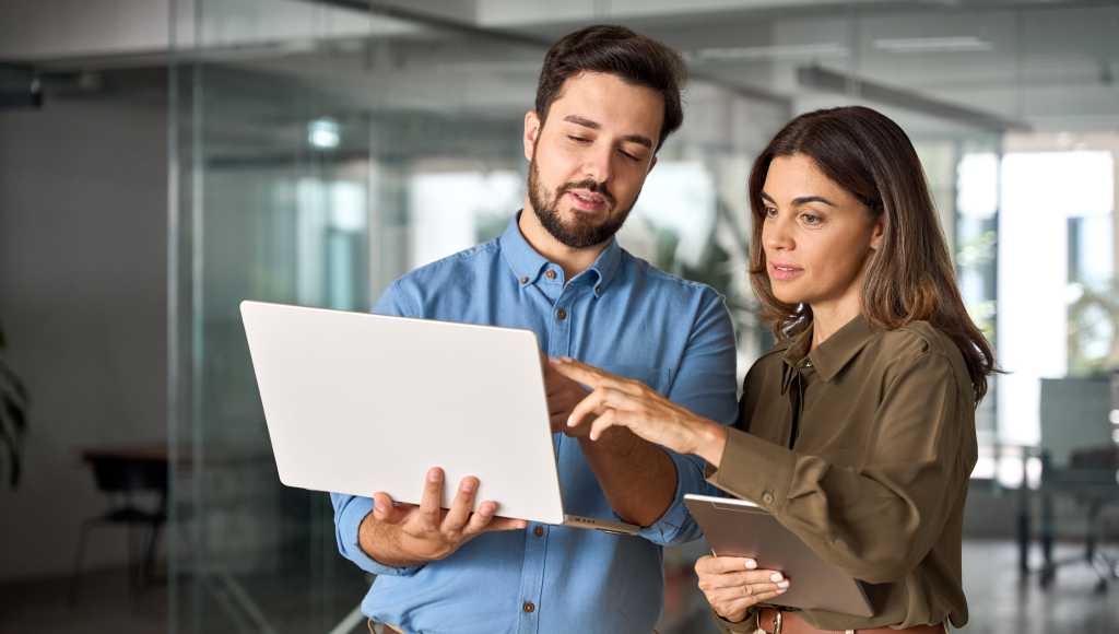 male female office laptop